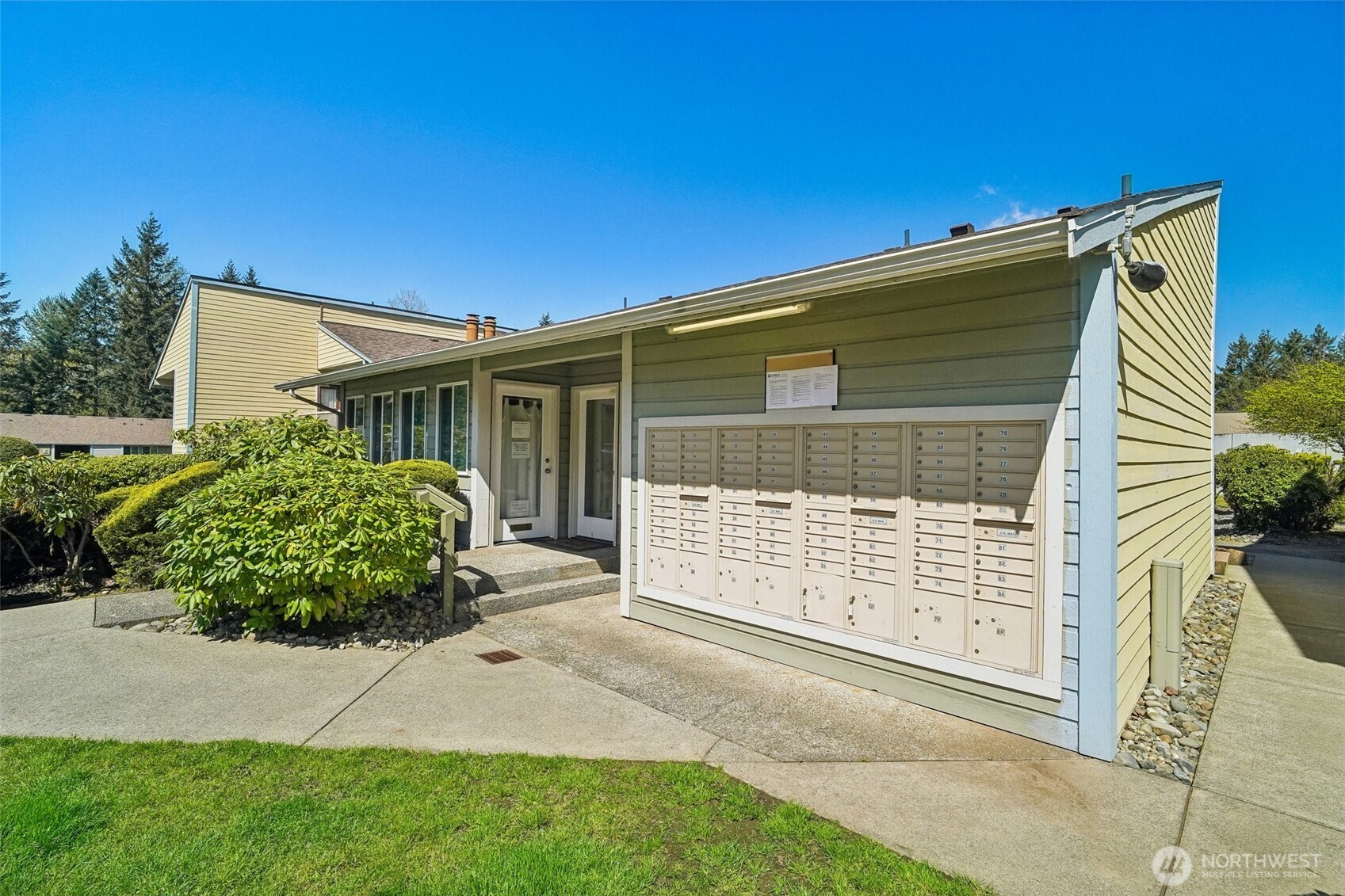 14401 Southeast Petrovitsky Road, Unit D205 Renton, WA 98058 - Photo 28 of 32 a front view of a house with garden
