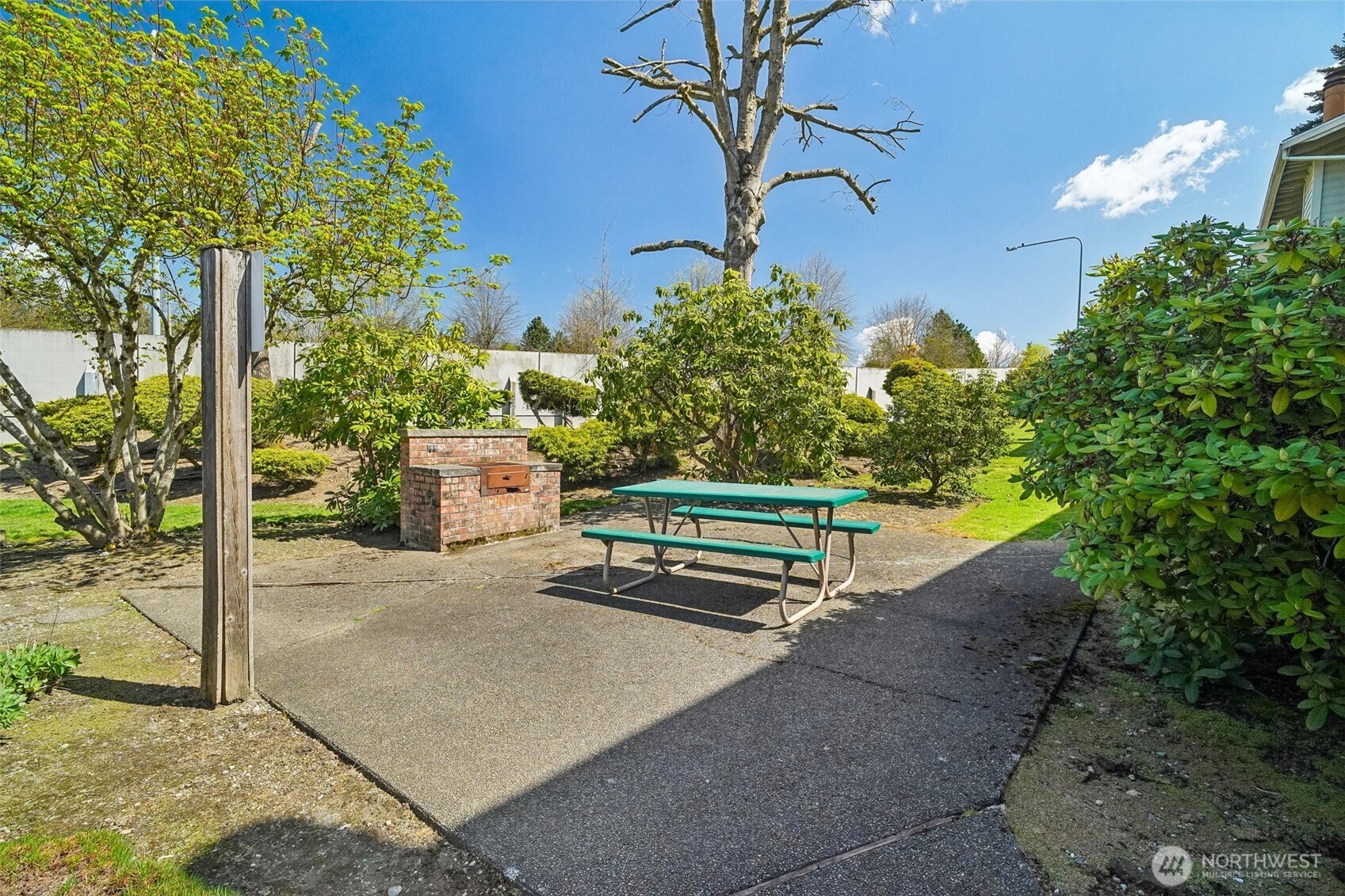 14401 Southeast Petrovitsky Road, Unit D205 Renton, WA 98058 - Photo 30 of 32 a park view with a bench