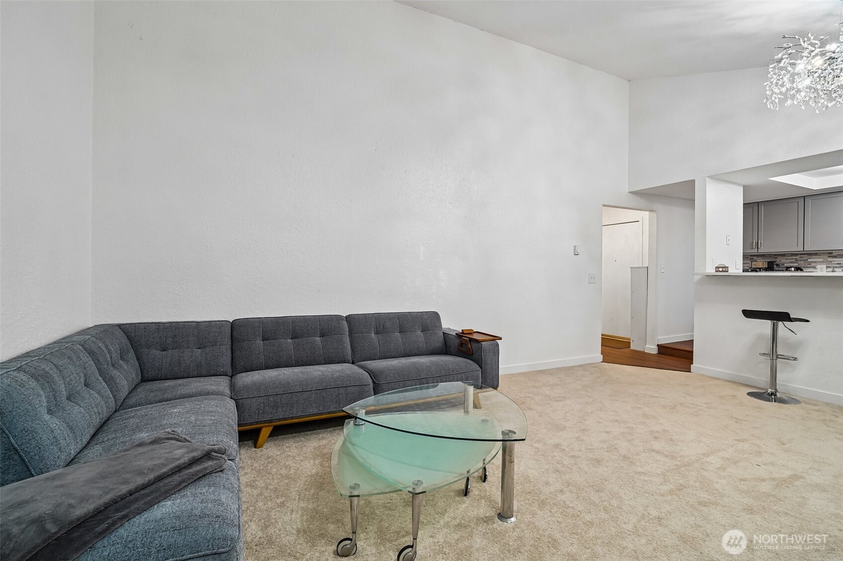 14401 Southeast Petrovitsky Road, Unit D205 Renton, WA 98058 - Photo 5 of 32 a living room with furniture and a couch