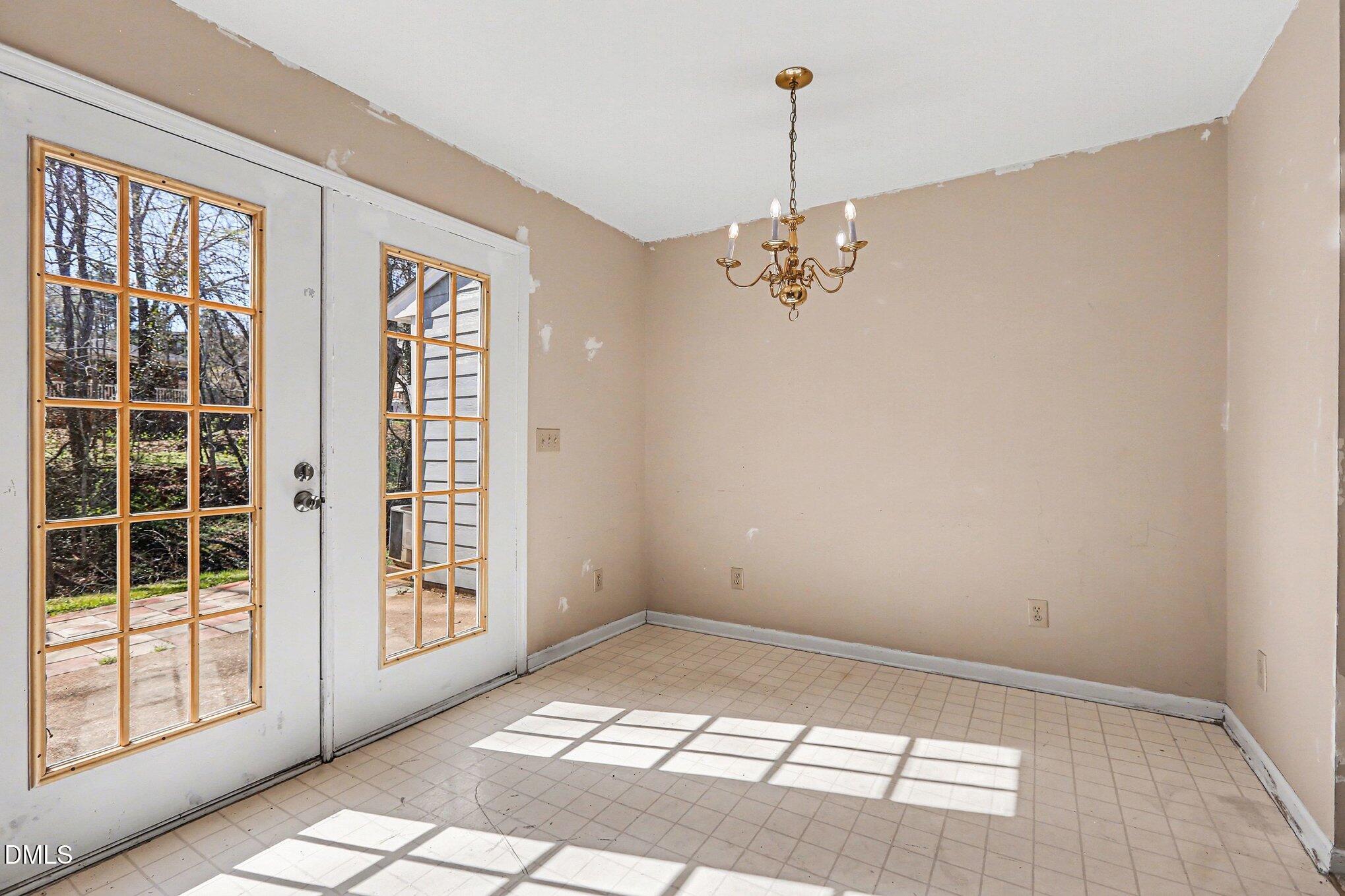 1812 Orange Grove Road, Unit 118 Hillsborough, NC 27278 - Photo 13 of 28 a view of an empty room with a window