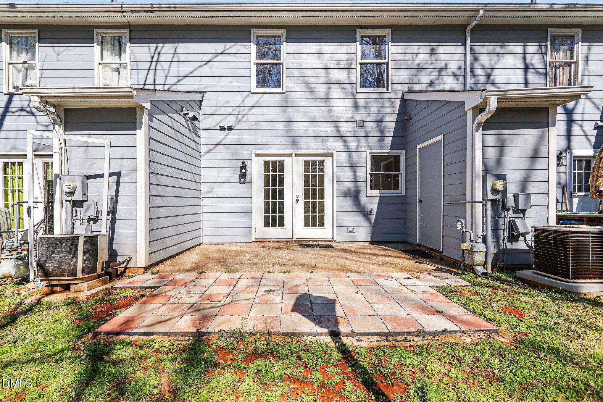 1812 Orange Grove Road, Unit 118 Hillsborough, NC 27278 - Photo 2 of 28 a front view of a house with a yard