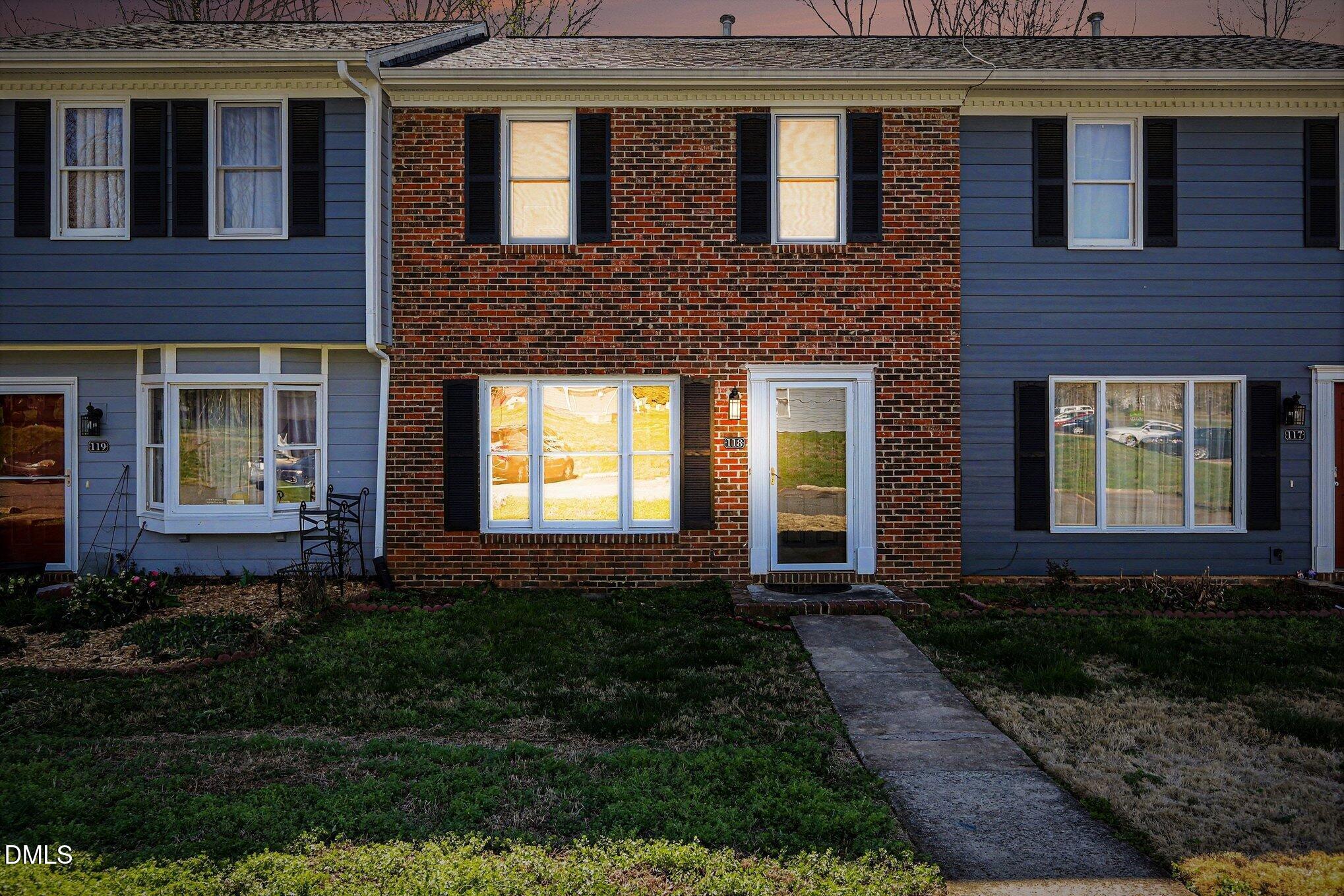 1812 Orange Grove Road, Unit 118 Hillsborough, NC 27278 - Photo 26 of 28 a brick house that has a lots of windows in it