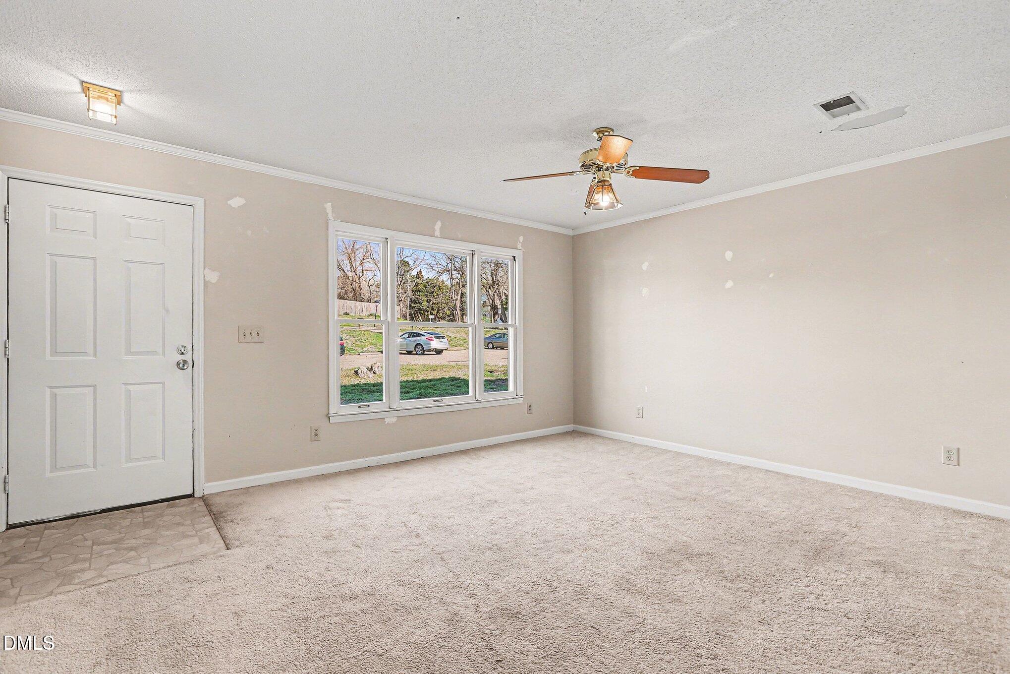 1812 Orange Grove Road, Unit 118 Hillsborough, NC 27278 - Photo 4 of 28 a view of an empty room with a window