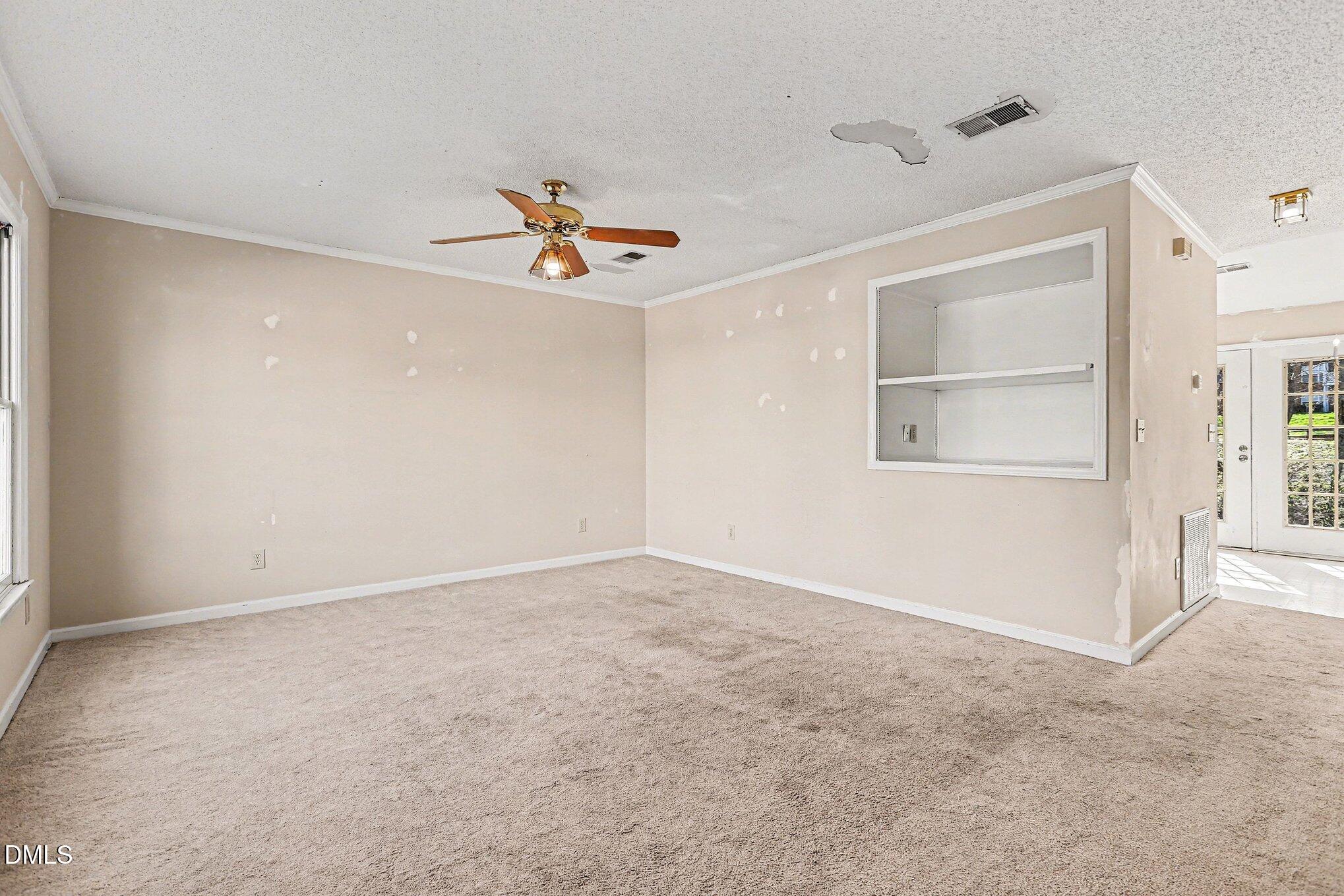 1812 Orange Grove Road, Unit 118 Hillsborough, NC 27278 - Photo 5 of 28 a view of an empty room with a window