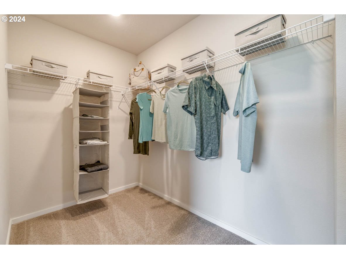 2967 V Street Springfield, OR 97477 - Photo 24 of 24 a view of walk in closet with clothes and shoes