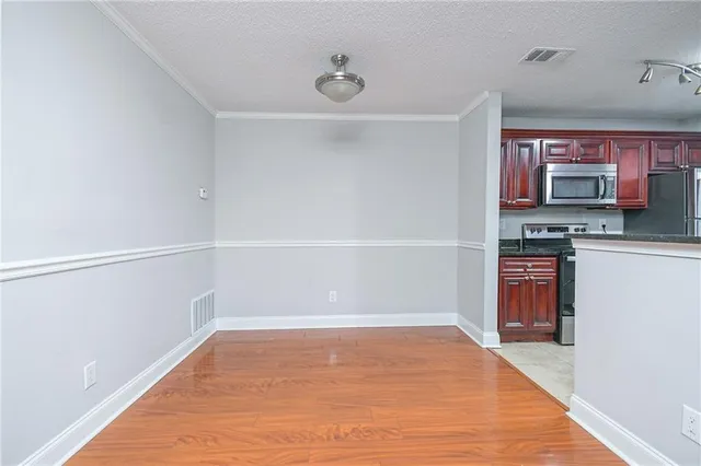 a view of kitchen and wooden floor