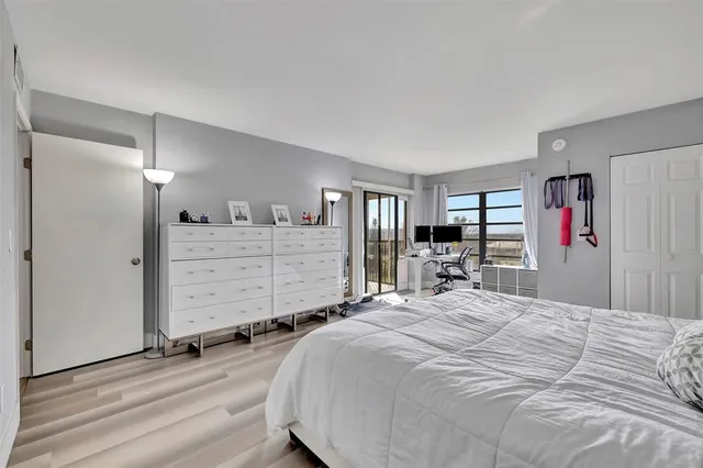 a bed room with a bed and a television