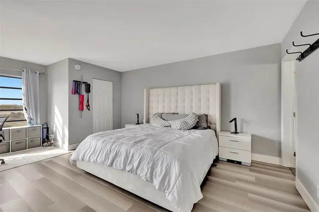 a bedroom with a bed and a dresser