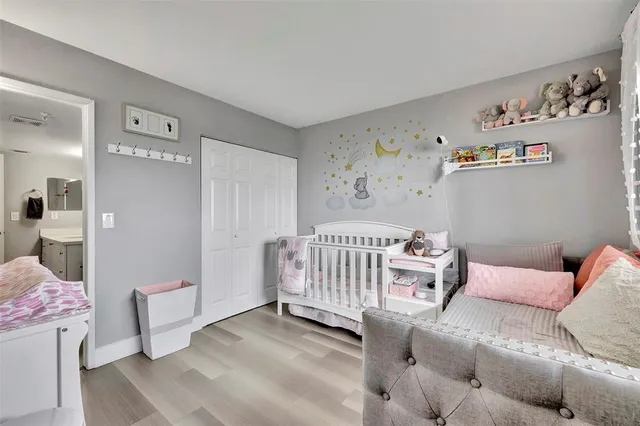 a bedroom with furniture and a window