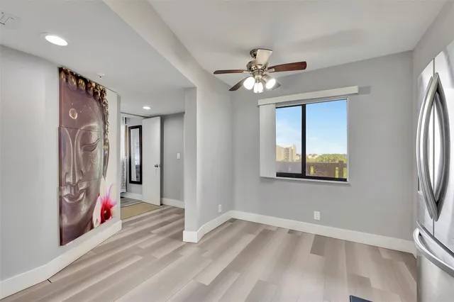 a view of an entryway with wooden floor
