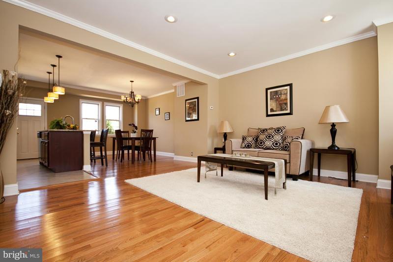 811 Wicklow Road Baltimore, MD 21229 - Photo 1 of 30 a living room with furniture and a wooden floor