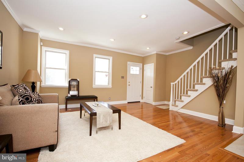 811 Wicklow Road Baltimore, MD 21229 - Photo 3 of 30 a living room with furniture and a wooden floor