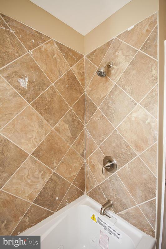 811 Wicklow Road Baltimore, MD 21229 - Photo 27 of 30 a bathroom with a sink and a shower