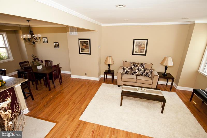 811 Wicklow Road Baltimore, MD 21229 - Photo 30 of 30 a living room with furniture and a wooden floor