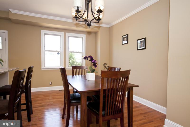 811 Wicklow Road Baltimore, MD 21229 - Photo 5 of 30 a view of a dining room with furniture window and wooden floor