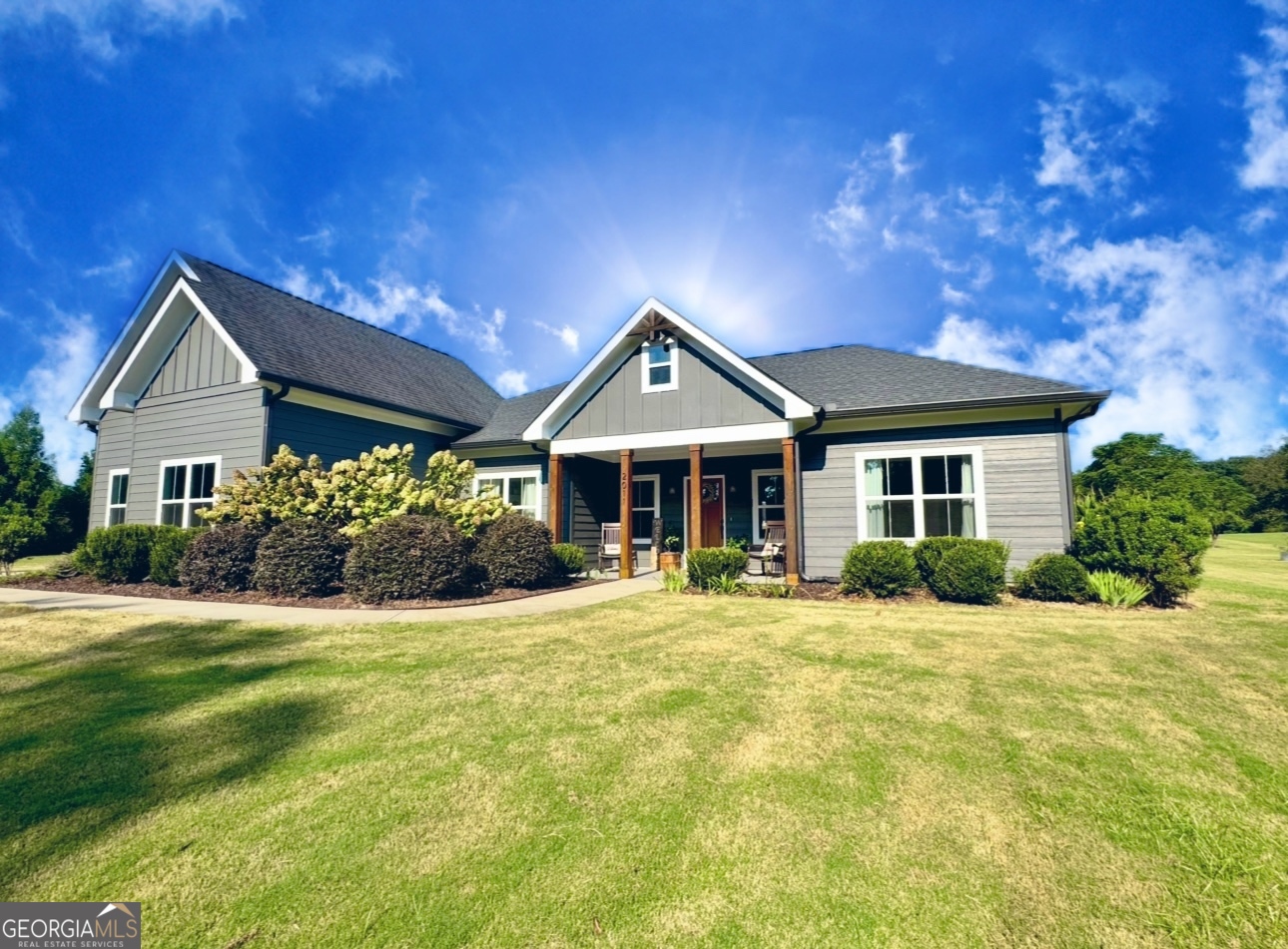 a front view of a house with a yard