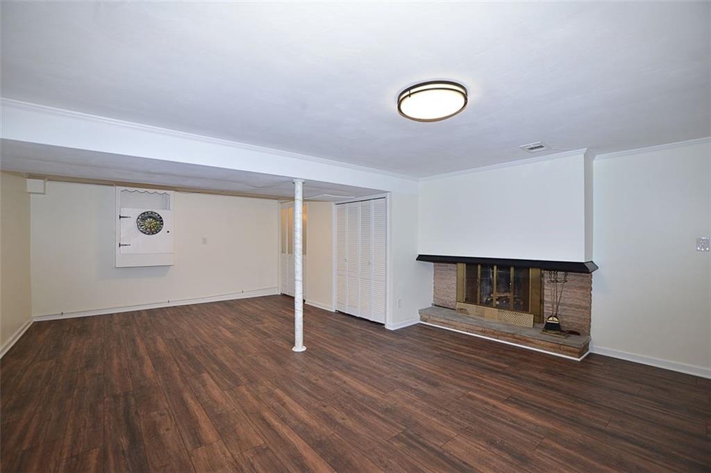 122 Easley Road Pittsburgh, PA 15237 - Photo 16 of 25 Huge 23'x16' Family Room with new flooring (storage under stairs to left)