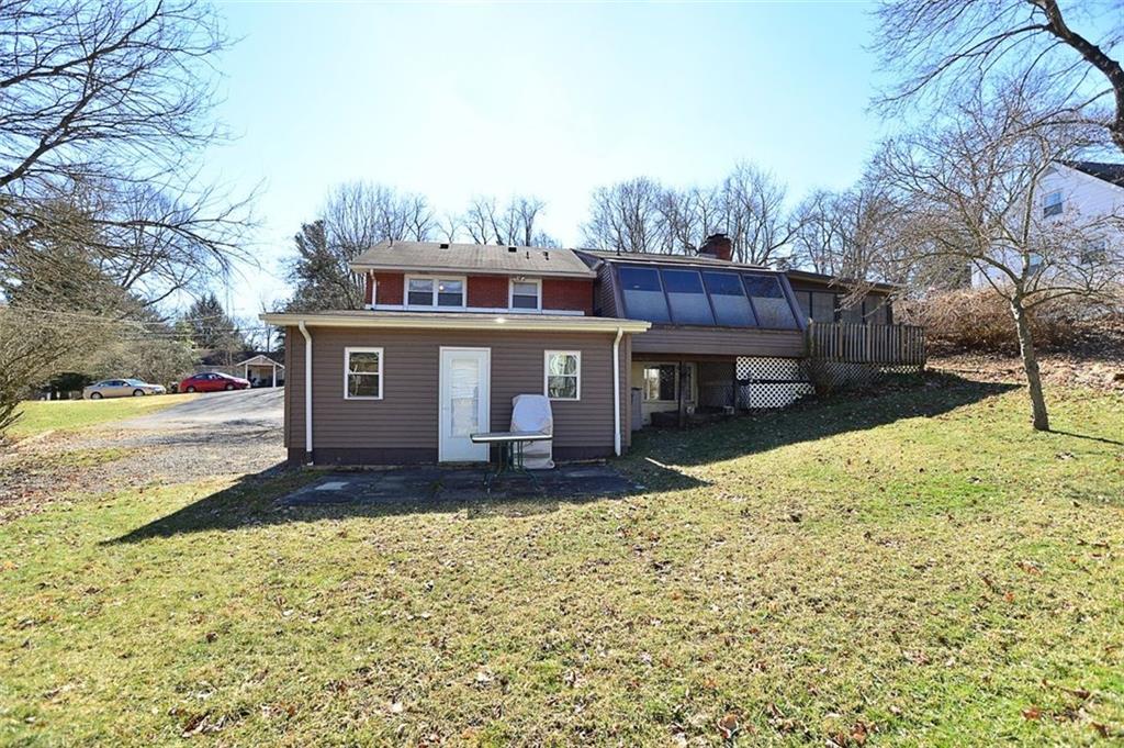122 Easley Road Pittsburgh, PA 15237 - Photo 23 of 25 Concrete patio for barbecues. Note the retractable blinds in the Sun Room.