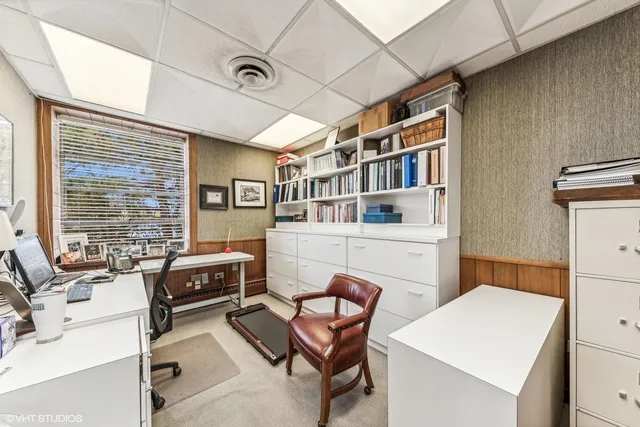 a room with furniture a flat screen tv and a table