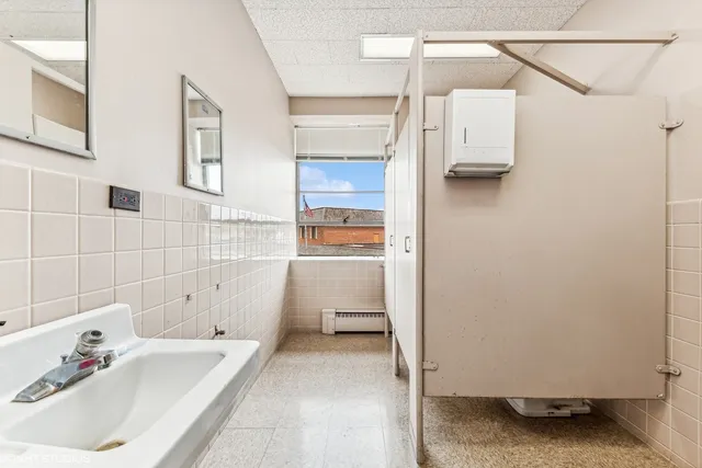 a bathroom with a sink and a shower