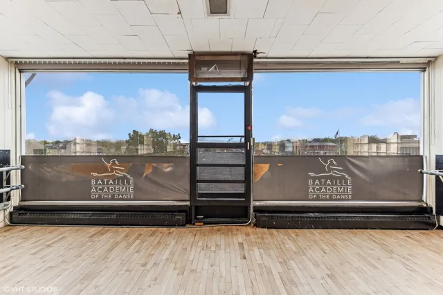 a view of a bench in front of building