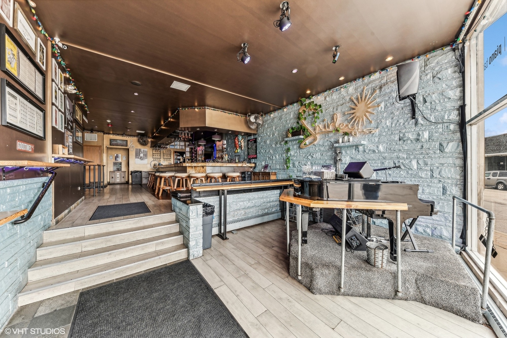 102 North Cook Street Barrington, IL 60010 - Photo 29 of 38 a living room with stainless steel appliances kitchen island granite countertop furniture and a fireplace