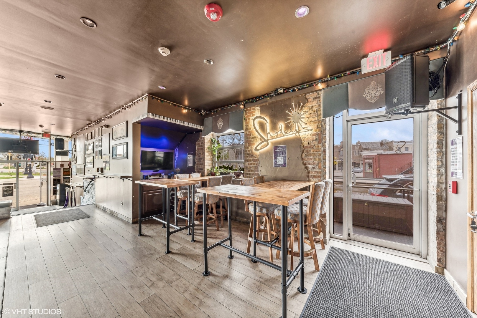 102 North Cook Street Barrington, IL 60010 - Photo 31 of 38 a kitchen with stainless steel appliances kitchen island granite countertop a table and chairs in it