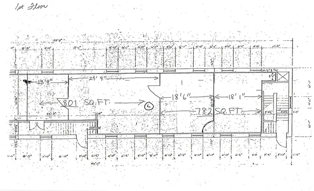 a black and white photo of a white building