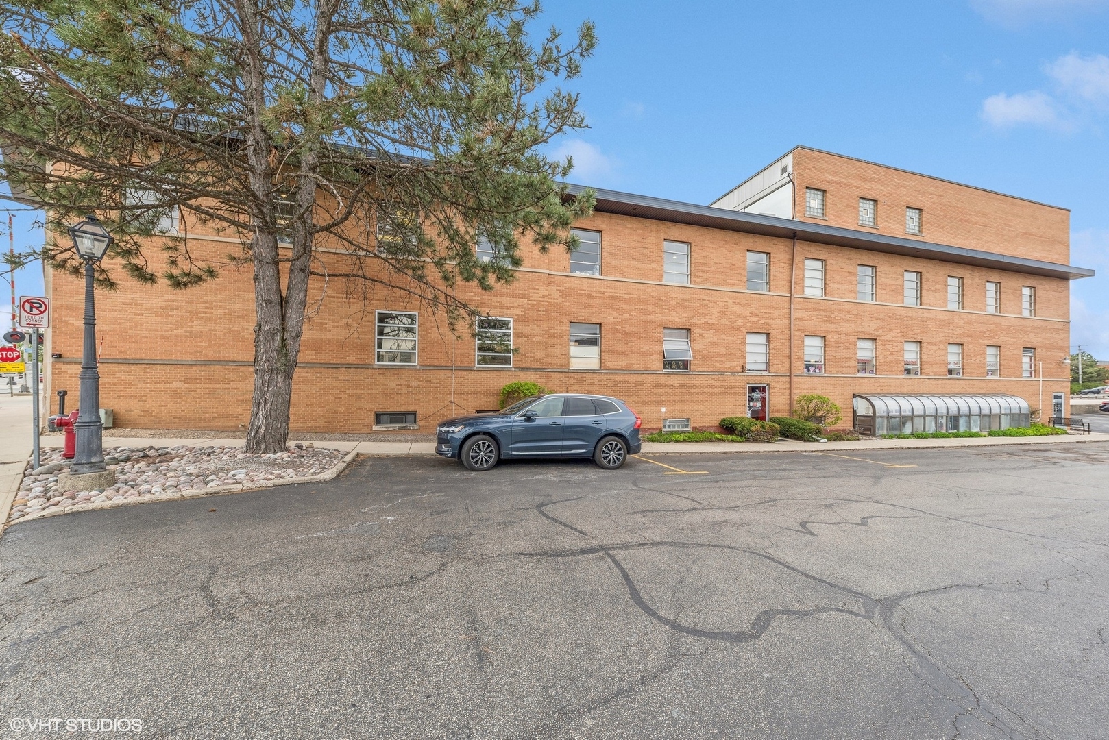 102 North Cook Street Barrington, IL 60010 - Photo 6 of 38 a car parked in front of a building