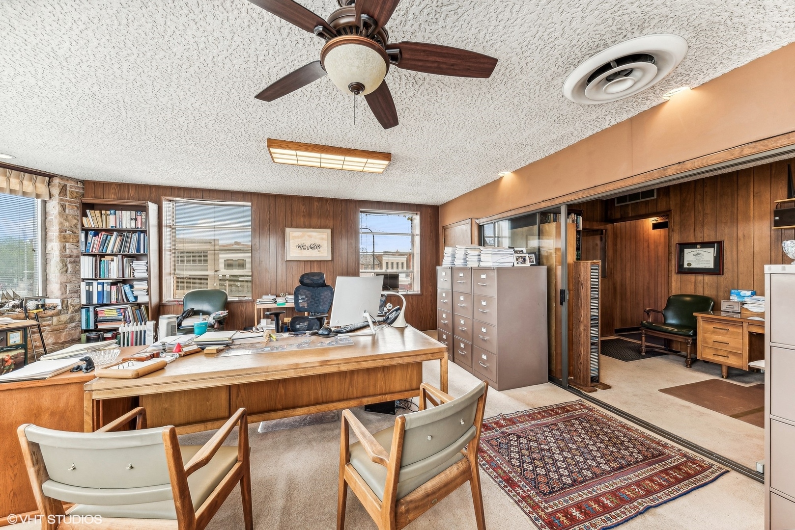 102 North Cook Street Barrington, IL 60010 - Photo 10 of 38 a living room with a couch and a table