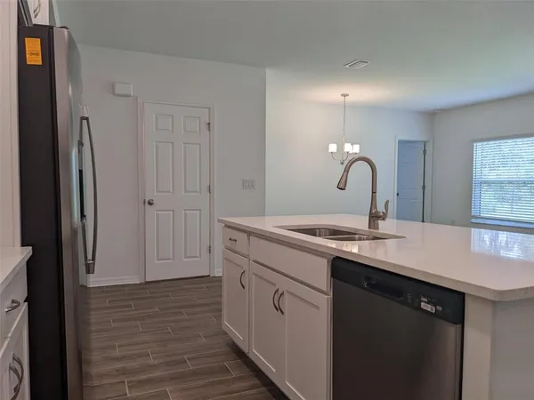 a kitchen with a sink and cabinets
