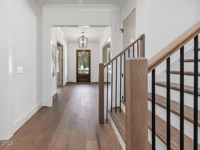 a living room with furniture potted plant and a fireplace
