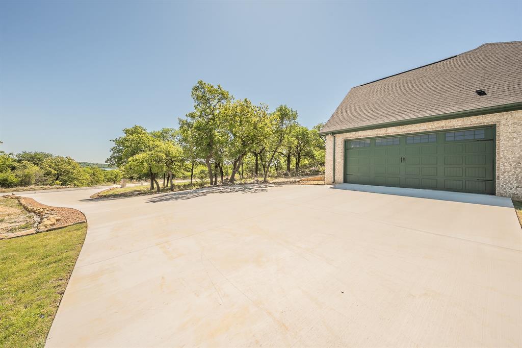 114 Ridgeline Drive Chico, TX 76431 - Photo 29 of 38 2 Car Garage with plenty of outdoor parking