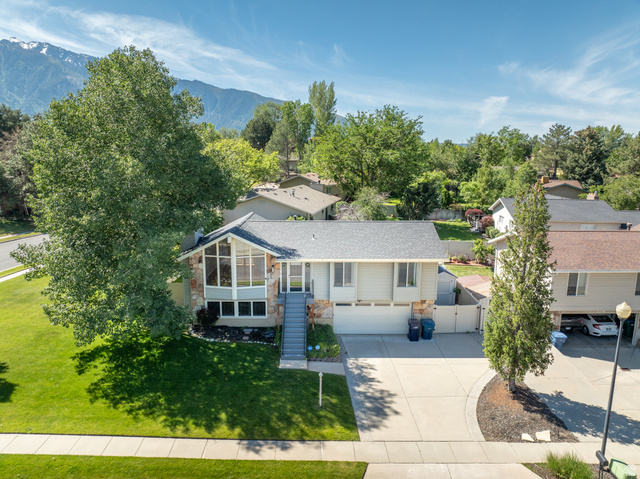 2088 Falcon Way Sandy, UT 84093 - Photo 34 of 46 Split-level residence featuring a stone facade and an expansive front lawn