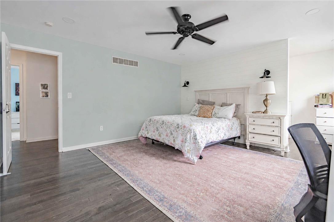 102 Sutton Road Easton, PA 18045 - Photo 38 of 83 Gleaming hardwood floors and a shiplap accent wall define this quiet retreat.