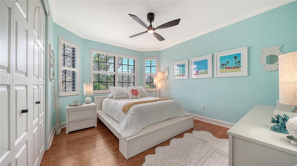 1630 Assisi Drive, Unit 18 Sarasota, FL 34231 - Photo 25 of 42 a bedroom with a bed and window