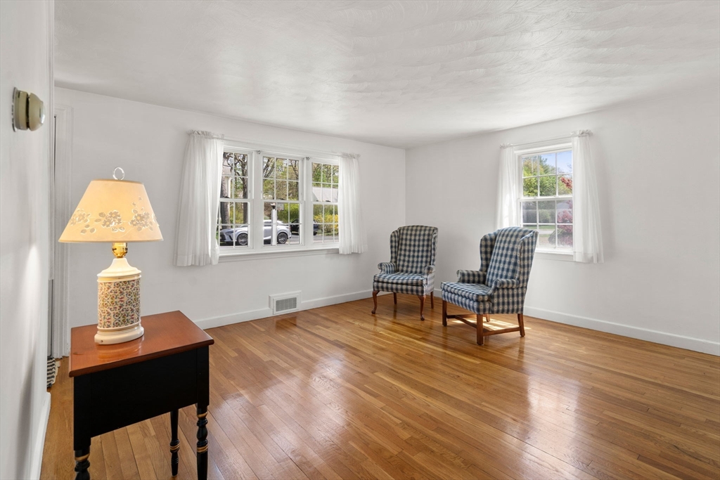 62 Felch Road Natick, MA 01760 - Photo 3 of 27 a workspace with furniture a bedroom and wooden floor