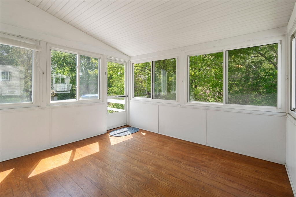 62 Felch Road Natick, MA 01760 - Photo 8 of 27 a view of an empty room with wooden floor and a window