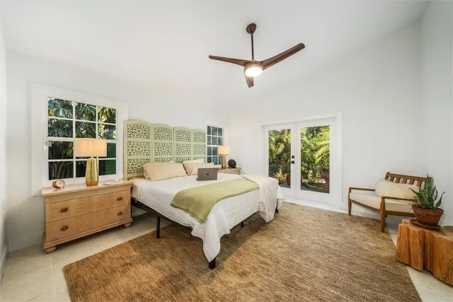 a bed room with a bed and a window