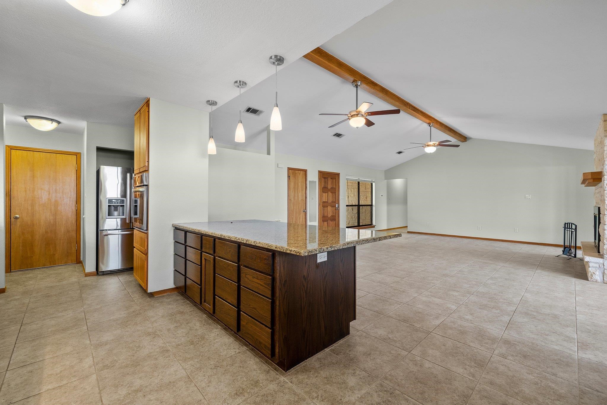 209 Senisa Drive Buchanan Dam, TX 78609 - Photo 11 of 30 an empty room with windows and cabinet