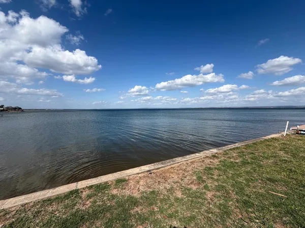 an aerial view of a house with outdoor space and street view