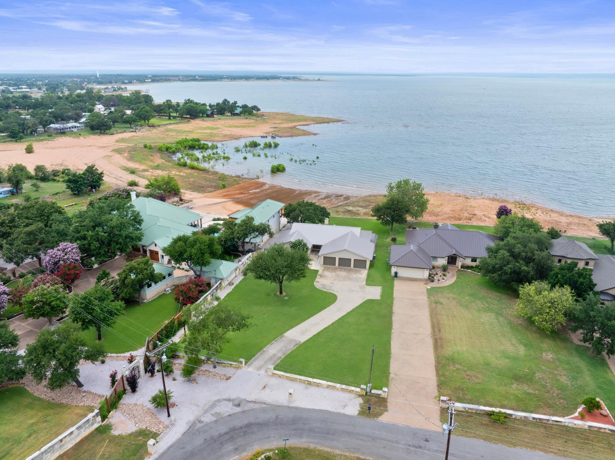 209 Senisa Drive Buchanan Dam, TX 78609 - Photo 29 of 30 an aerial view of ocean with residential house lake and mountain view in back