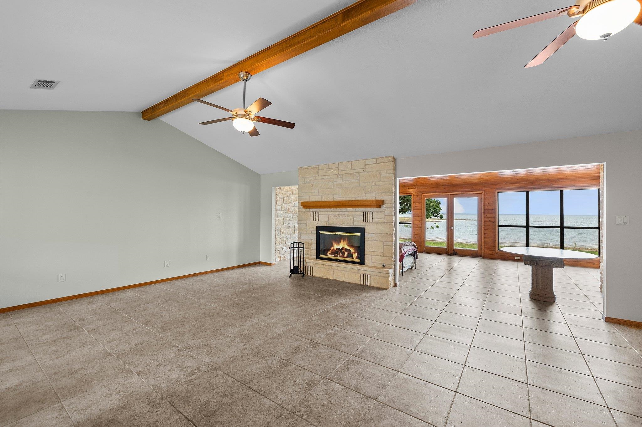 209 Senisa Drive Buchanan Dam, TX 78609 - Photo 3 of 30 a view of an empty room with a fireplace and a window