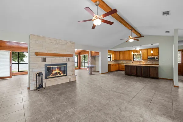 a view of an empty room with a fireplace