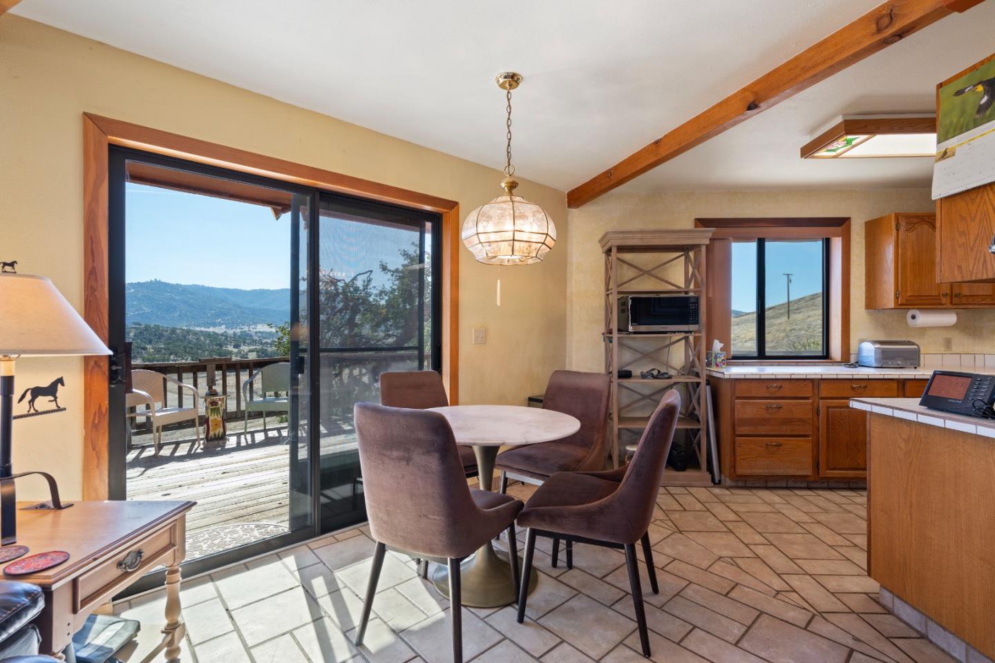 20101 Panoche Road Paicines, CA 95043 - Photo 20 of 97 a dining room with furniture window wooden floor and a chandelier