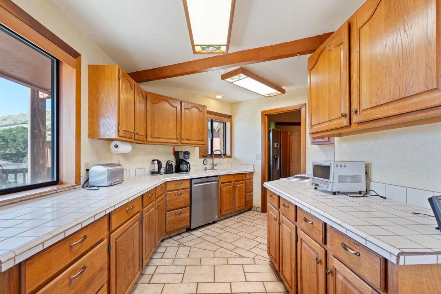 20101 Panoche Road Paicines, CA 95043 - Photo 21 of 97 a kitchen with stainless steel appliances granite countertop a sink and cabinets