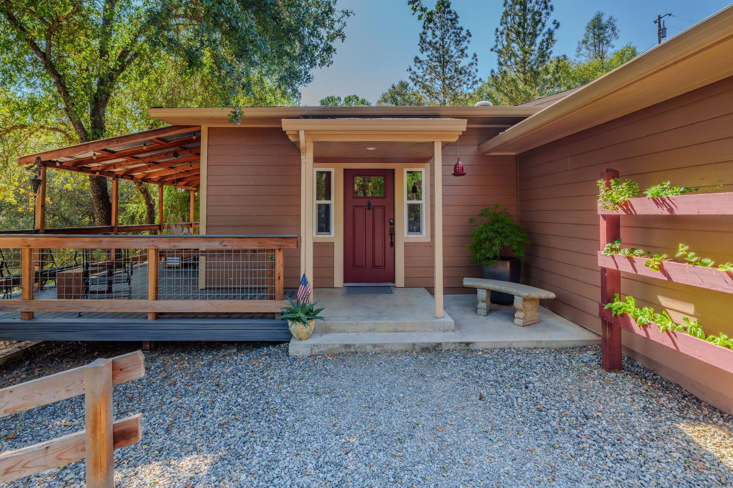 a view of a house with backyard and sitting area