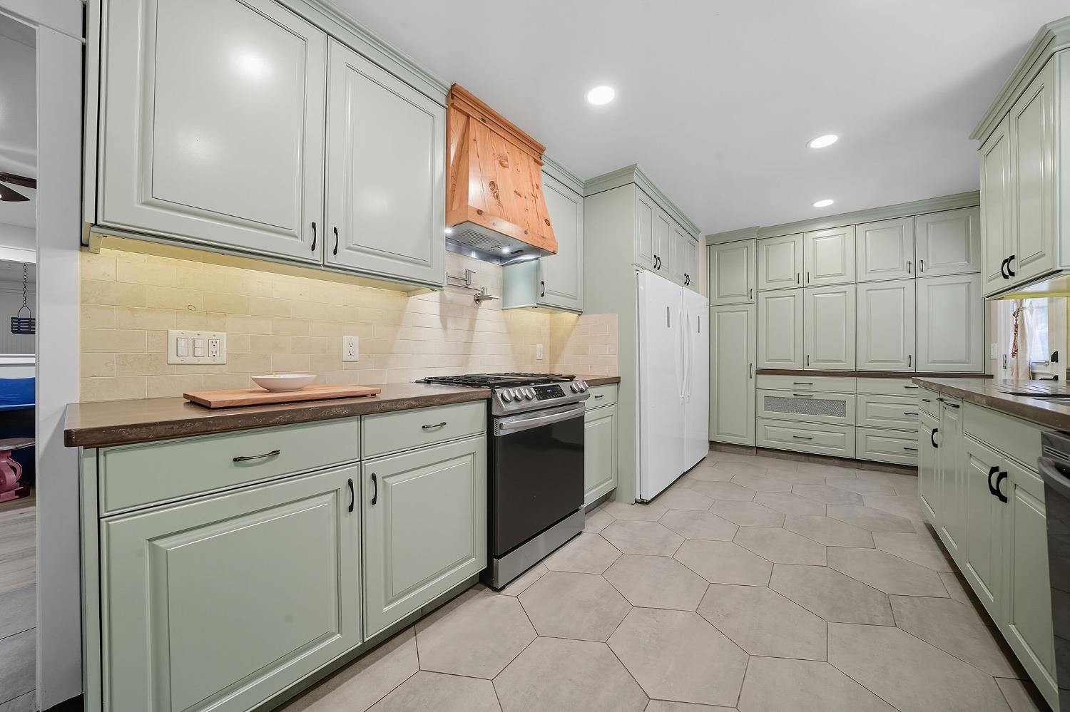2988 Spring Hill Road San Andreas, CA 95249 - Photo 21 of 95 a kitchen with granite countertop white cabinets and stainless steel appliances