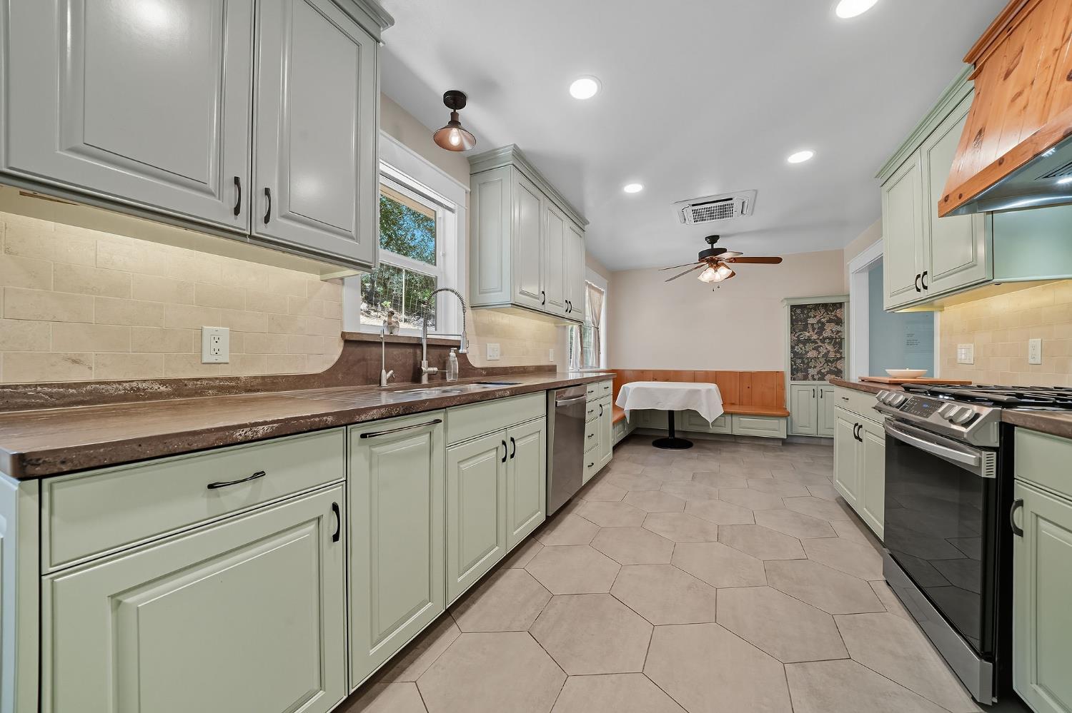 2988 Spring Hill Road San Andreas, CA 95249 - Photo 22 of 95 a kitchen with granite countertop a sink dishwasher stove and cabinets