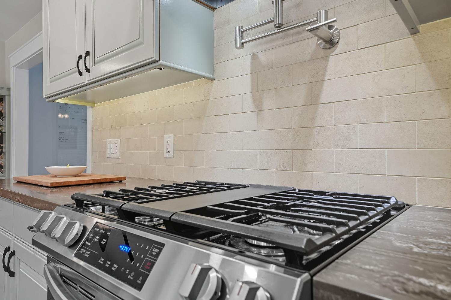 2988 Spring Hill Road San Andreas, CA 95249 - Photo 24 of 95 a stove sitting inside of a kitchen with granite countertop a stove